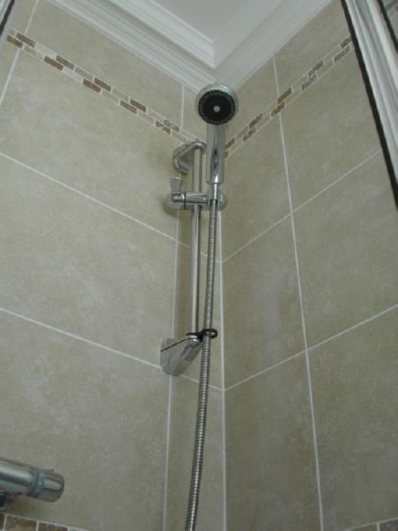 Travertine tiles, en-suite shower and W.C